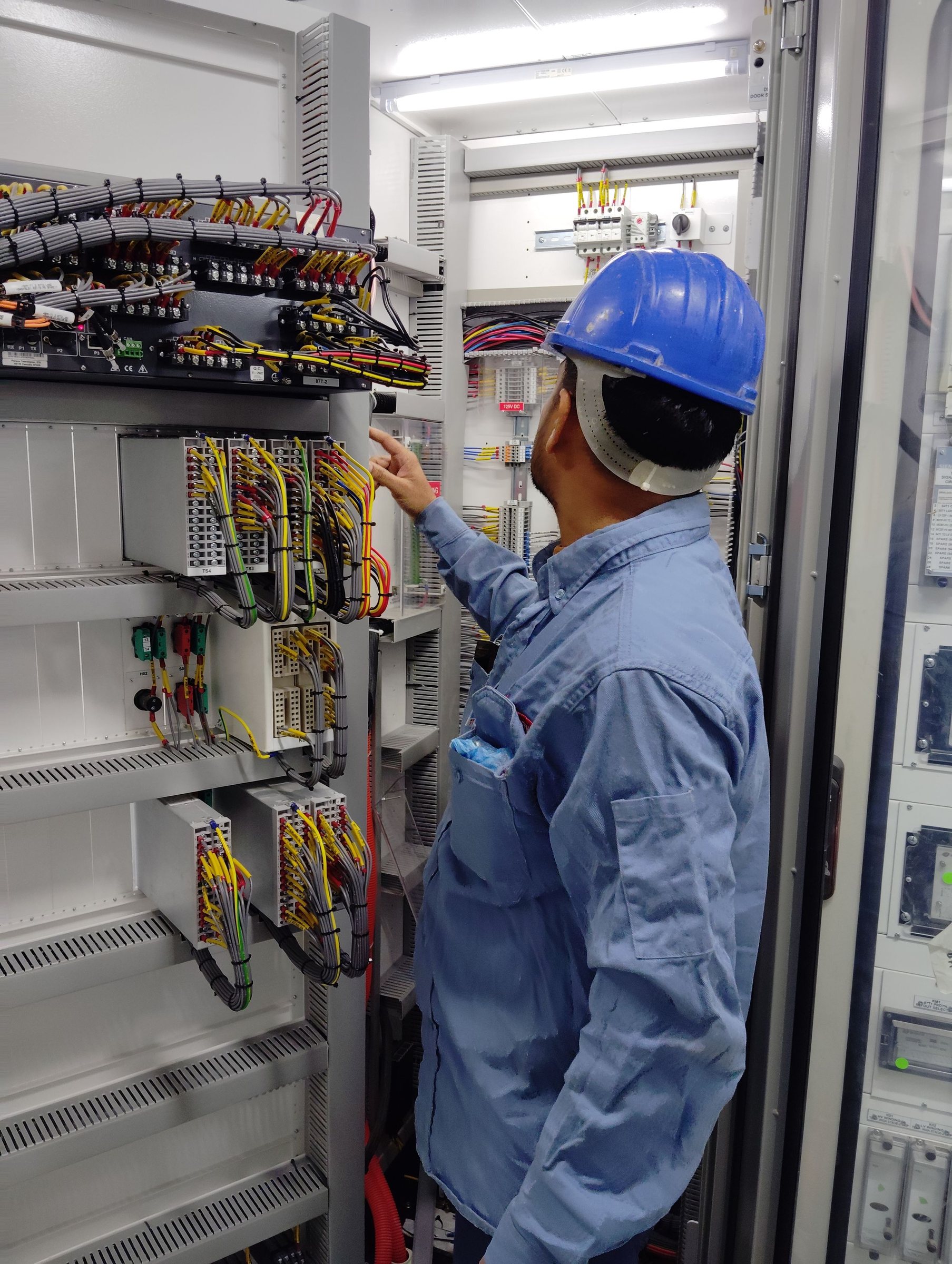 Electrician working safely with electrical cables