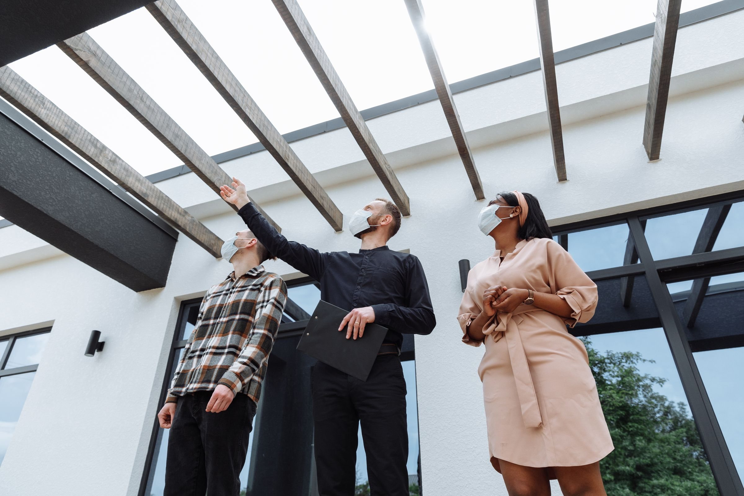 Real estate agent showing a property to clients