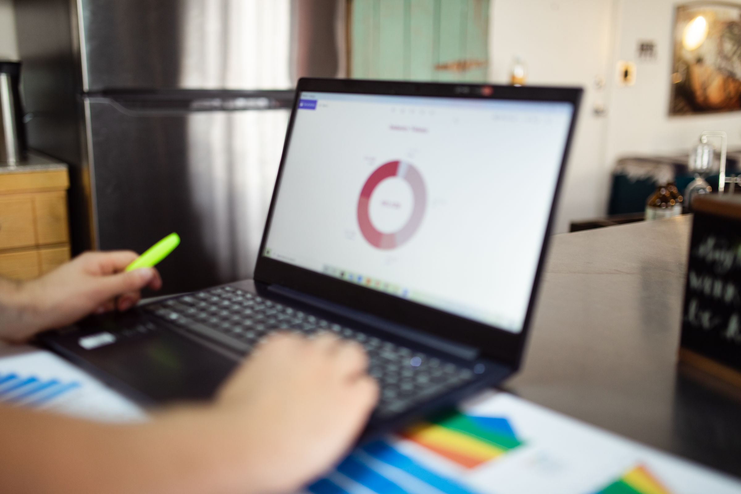 Professional researching digital information on a laptop