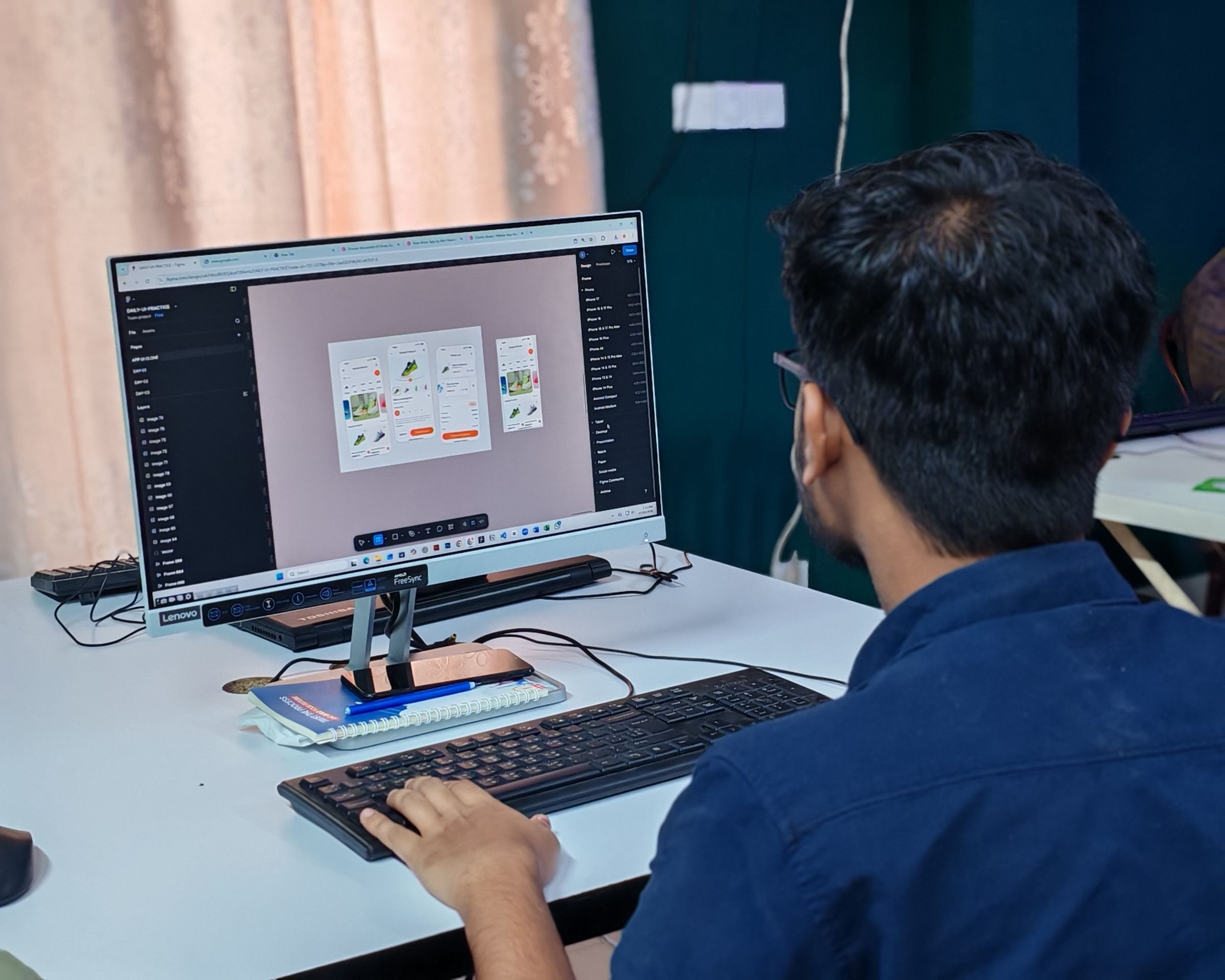 Website designer creating an interface at a desktop computer